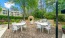 a patio with tables and chairs