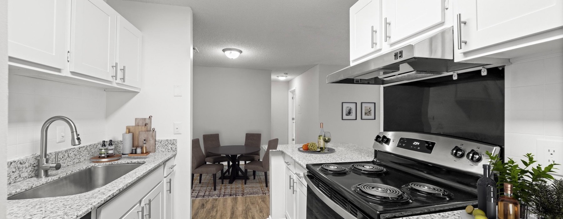a kitchen with white cabinets